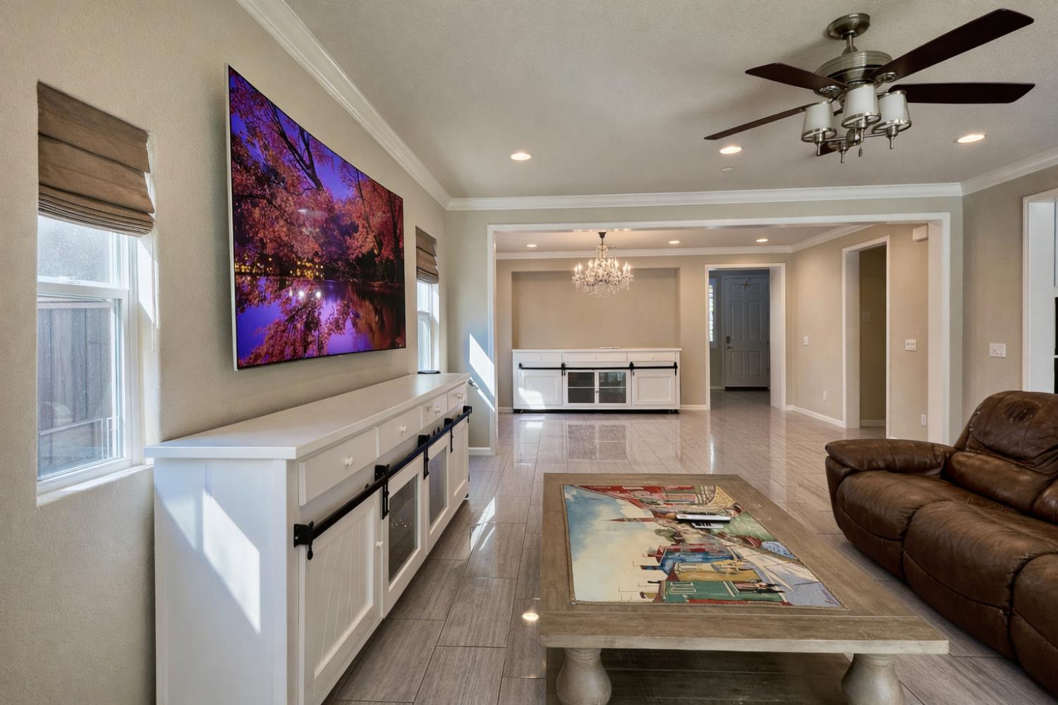 2557 Creek Hollow Road Rocklin, CA 95765 - Photo 8 of 27 a living room with furniture and a flat screen tv