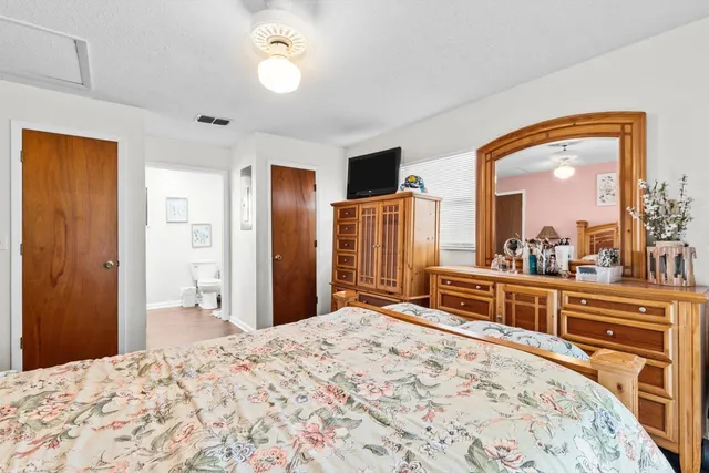 a bathroom with a toilet a sink and a shower