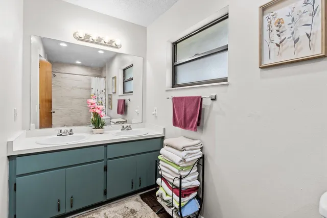 a bathroom with a toilet and a bathtub