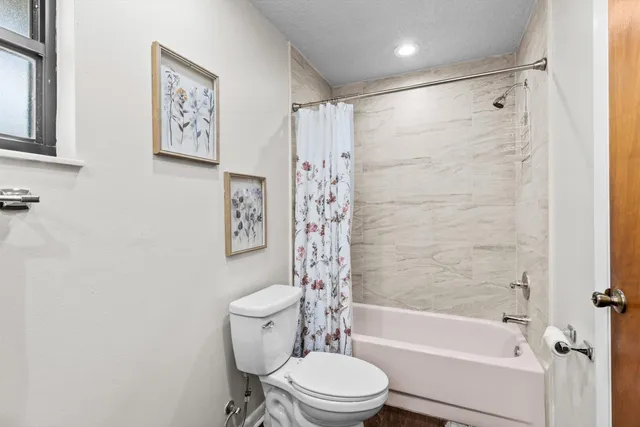 a bedroom with a bed and a table in it