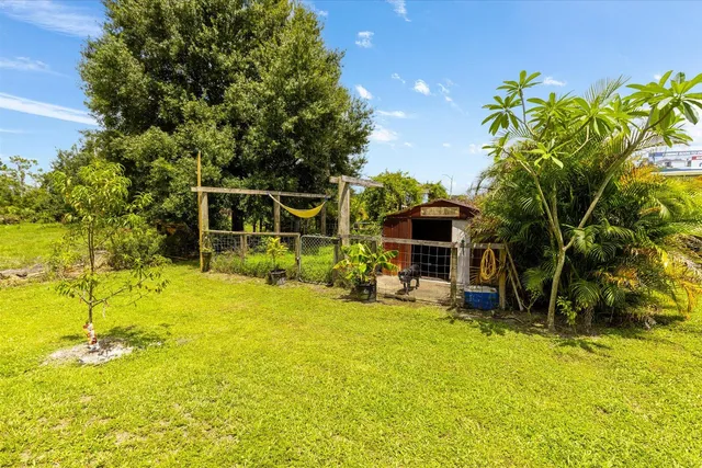 a view of a swimming pool with an outdoor space and seating area