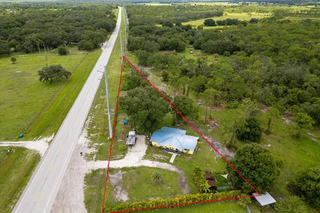 a view of a swimming pool with a yard