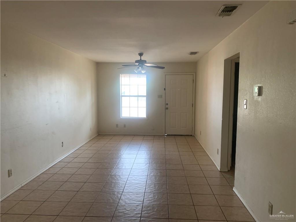 918 East Preston Avenue, Unit 4 Pharr, TX 78577 - Photo 4 of 10 an empty room with windows and closet