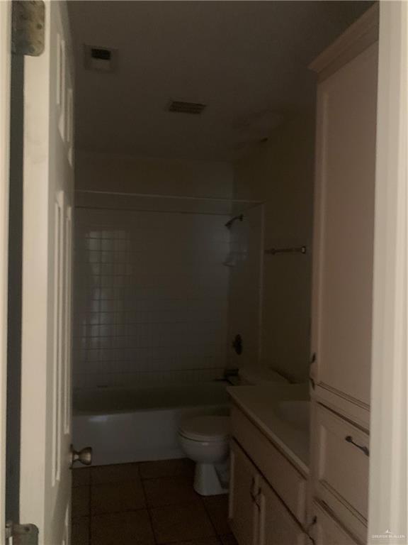 918 East Preston Avenue, Unit 4 Pharr, TX 78577 - Photo 5 of 10 a bathroom with a granite countertop toilet and sink