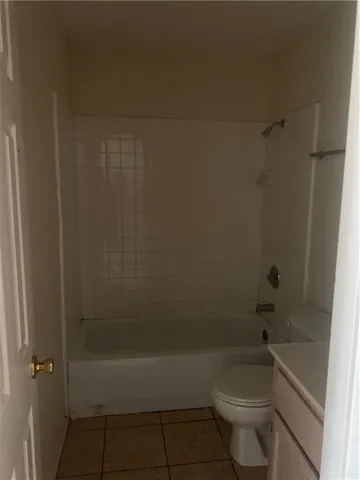 a bathroom with a bathtub and a toilet