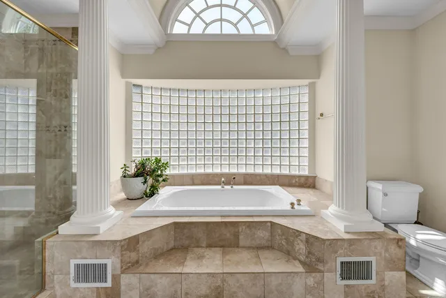 a bathroom with a bathtub and sink