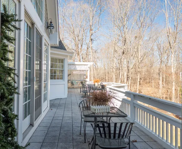 a view of two chairs in the balcony