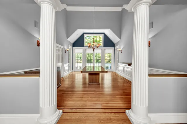 a view of an entryway with wooden floor windows