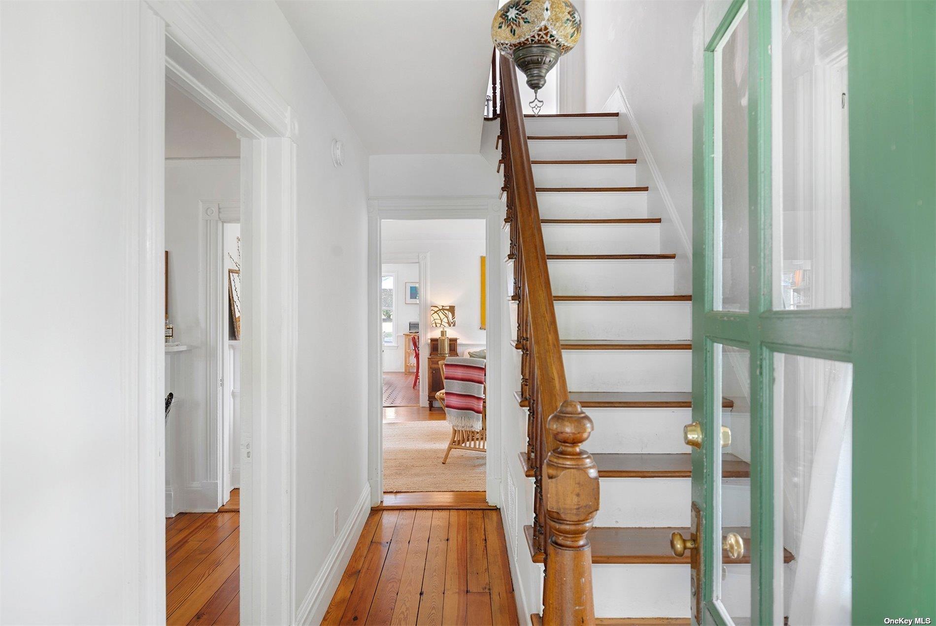 640 Orchard Street New Suffolk, NY 11956 - Photo 15 of 30 a view of a hallway with wooden floor and entryway
