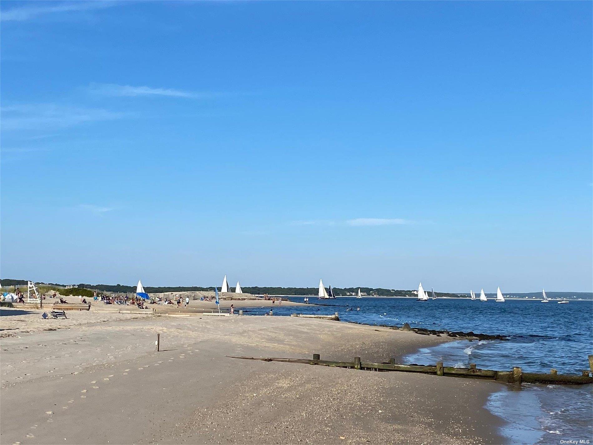 640 Orchard Street New Suffolk, NY 11956 - Photo 27 of 30 an aerial view of a building and trees