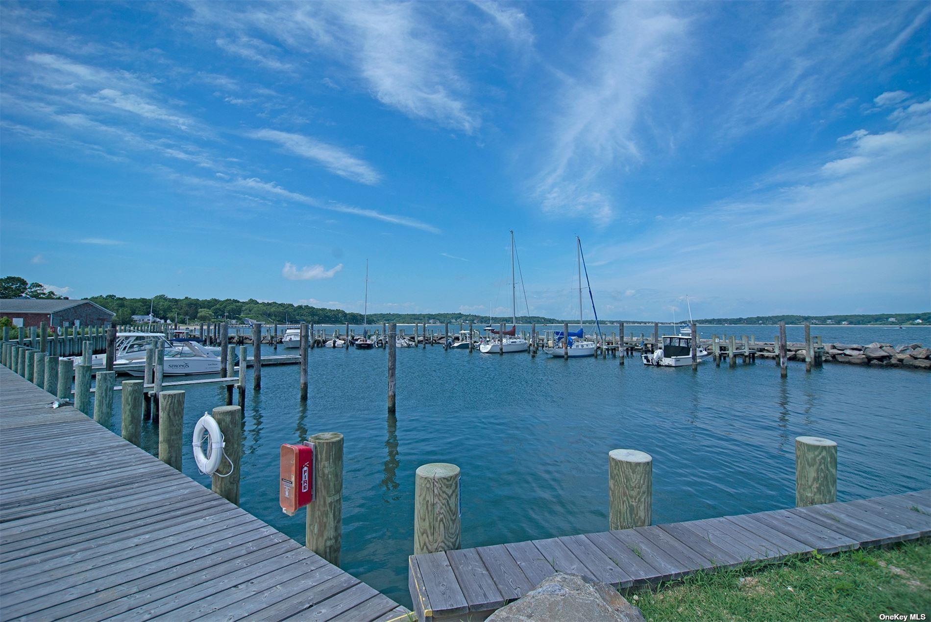 640 Orchard Street New Suffolk, NY 11956 - Photo 28 of 30 a view of a lake with a terrace