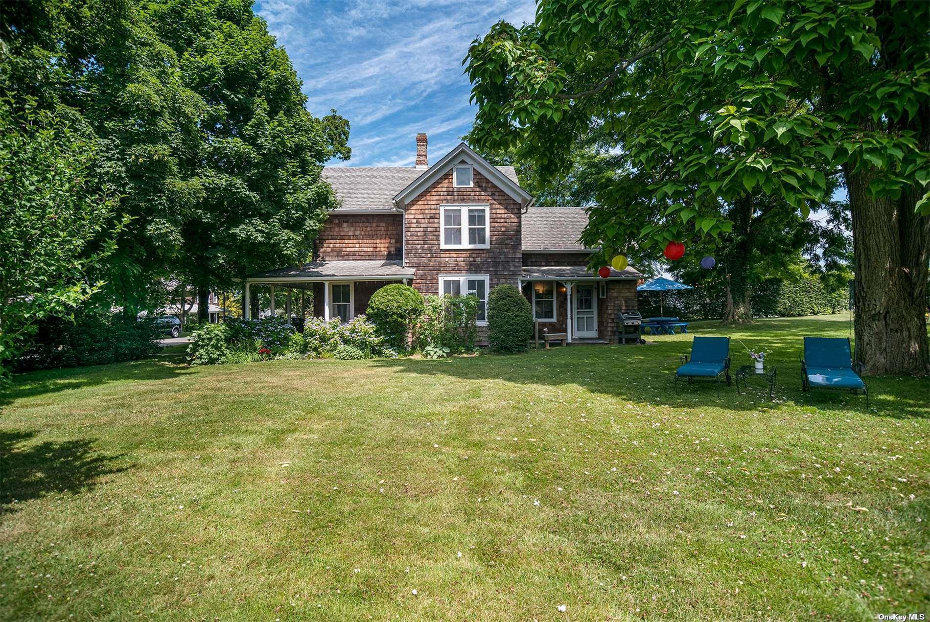640 Orchard Street New Suffolk, NY 11956 - Photo 4 of 30 a house view with a sitting space and garden