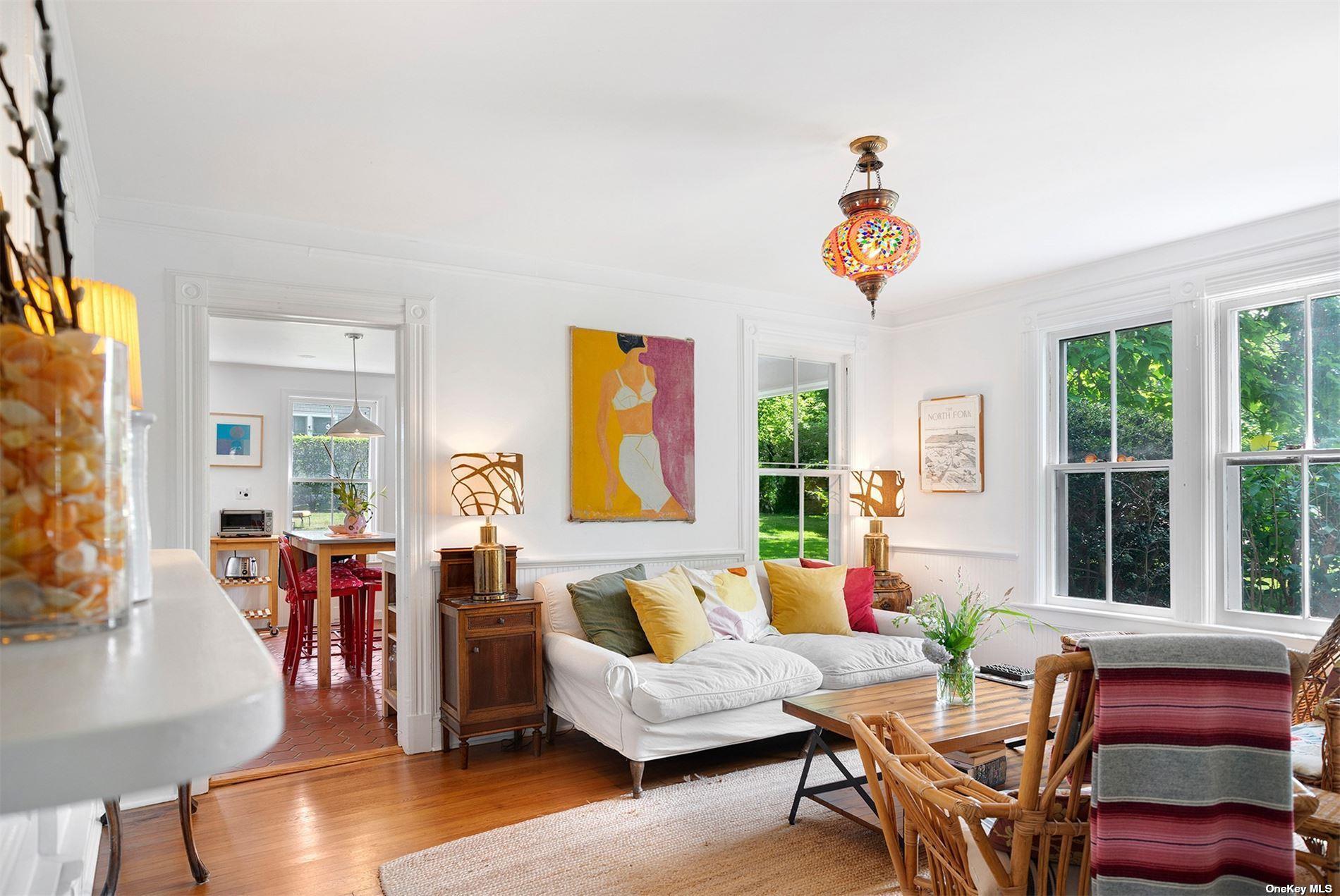 640 Orchard Street New Suffolk, NY 11956 - Photo 8 of 30 a living room with furniture a wooden floor and a window