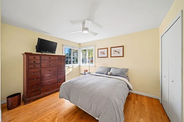 a bedroom with a bed and a television