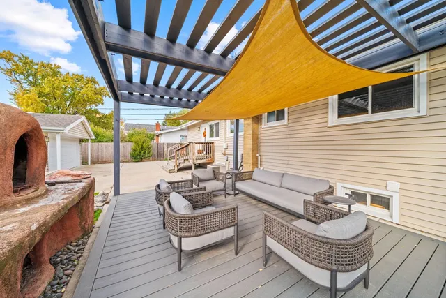 a balcony with furniture and a fireplace