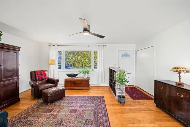 a living room with furniture rug and window
