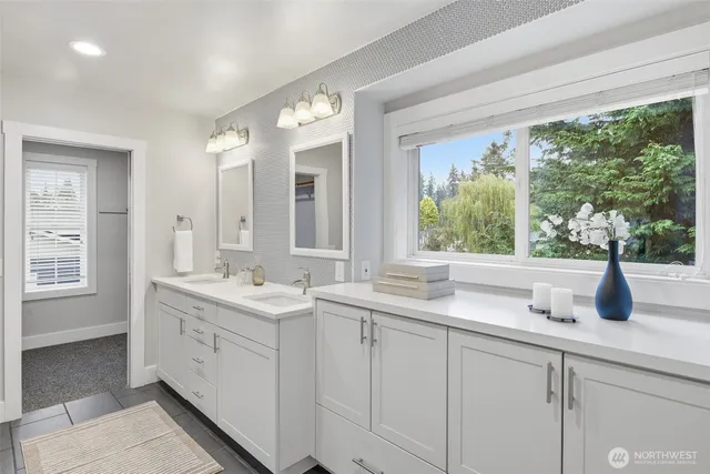a kitchen with a sink and large window