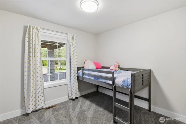 a reading room with furniture and a window