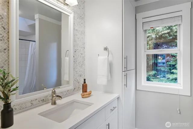 a bathroom with a sink and a mirror