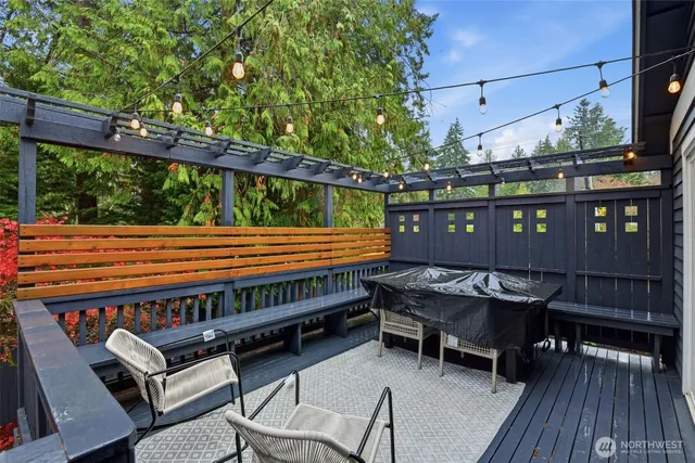 a view of a backyard with sitting area