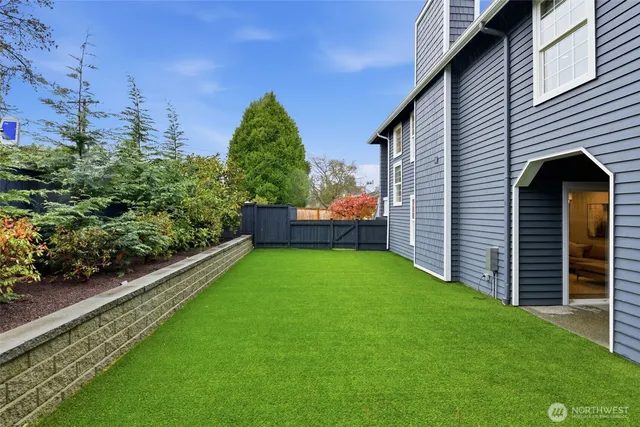 a backyard of a house with lots of green space