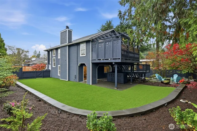 a view of a backyard with sitting area