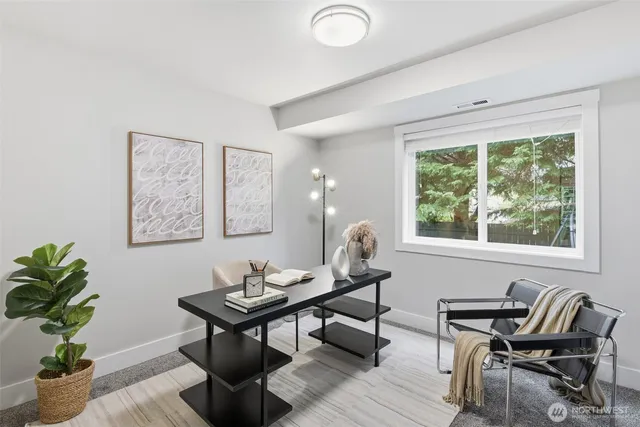 a workspace with furniture and a potted plant