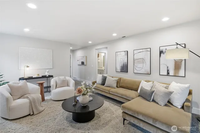 a living room with furniture and white walls