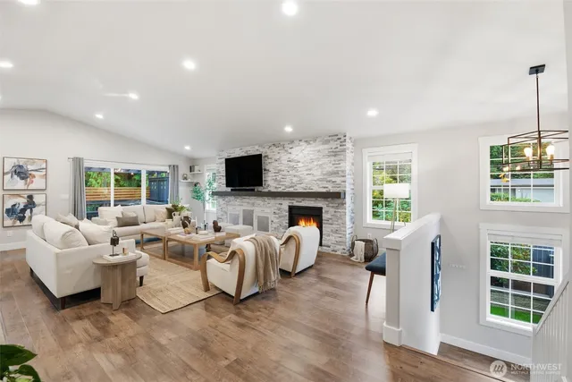 a living room with furniture fireplace and flat screen tv