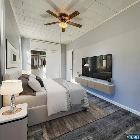 a living room with a couch and a flat screen tv