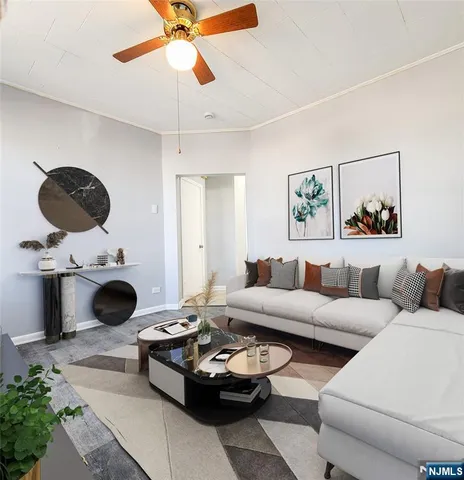 a living room with furniture and a floor to ceiling window