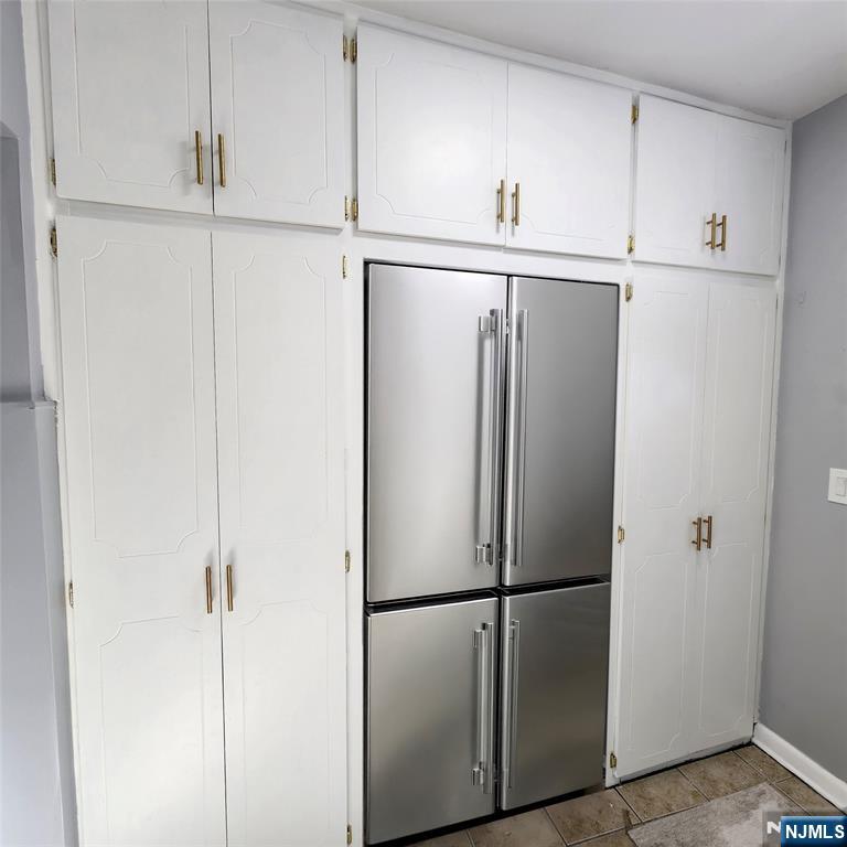 640 Chase Avenue, Unit 2 Lyndhurst, NJ 07071 - Photo 8 of 10 a white refrigerator freezer and cabinets in a kitchen