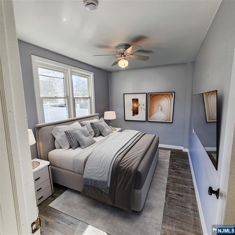 640 Chase Avenue, Unit 2 Lyndhurst, NJ 07071 - Photo 9 of 10 a bedroom with a large bed and a chandelier