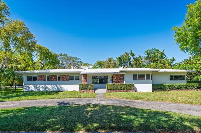 a view of a house with a swimming pool