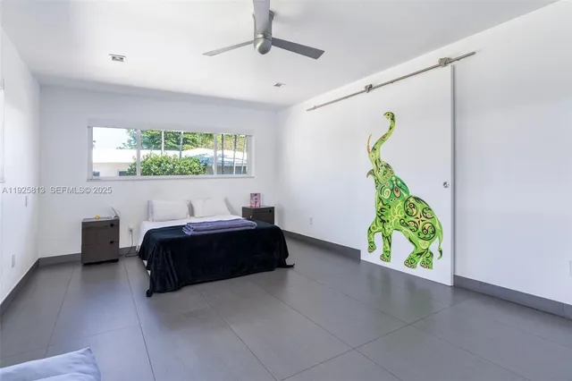 a bathroom with a shower and a sink