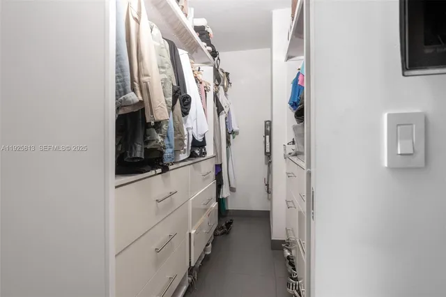 a view of a kitchen with furniture and a ceiling fan