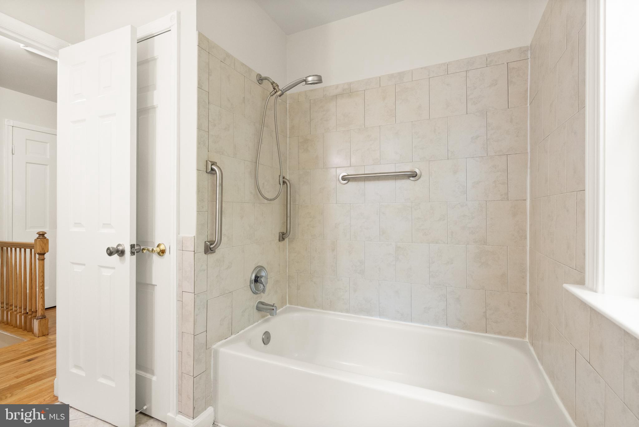7075 Yates Ford Road Manassas, VA 20111 - Photo 42 of 54 Modern bathroom with elegant tile accents.