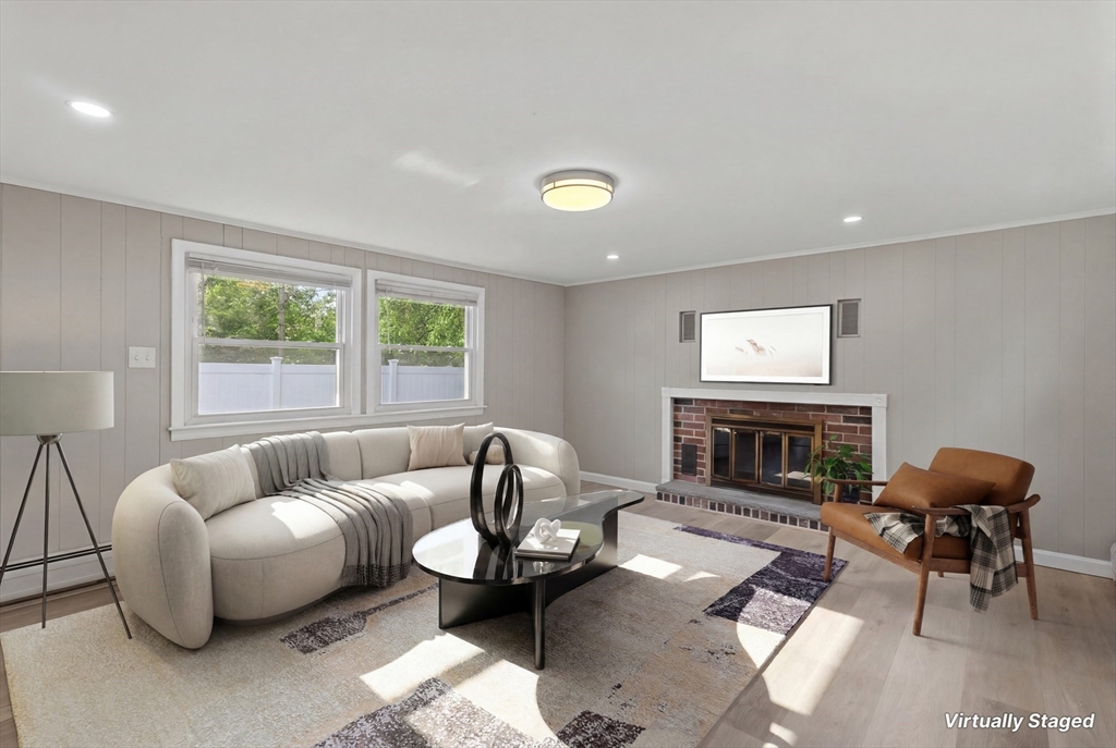 5 Phoenix Street Worcester, MA 01604 - Photo 17 of 32 a living room with furniture a fireplace and a window