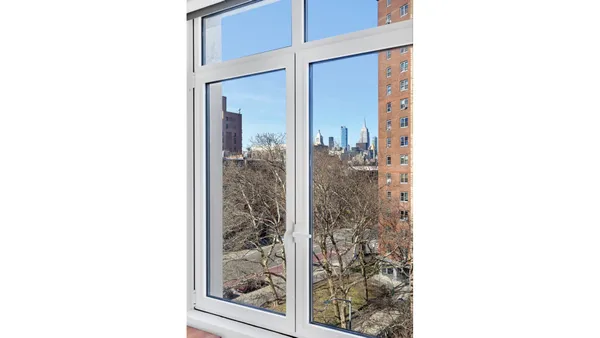a view of a room with a large window