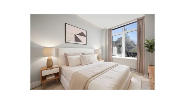 a room with a bed and a large mirror