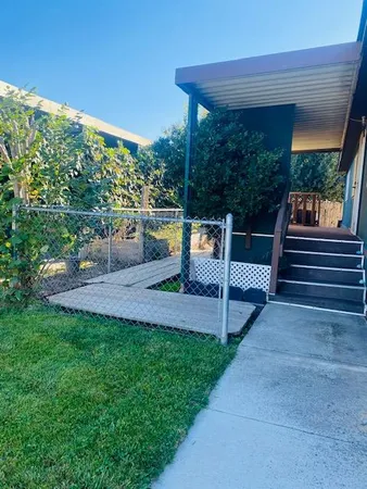 a view of yard with patio