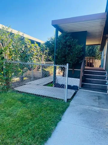 a view of yard with patio