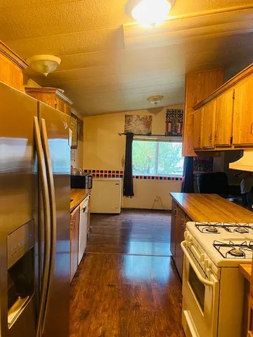 a view of a kitchen with a sink and dishwasher
