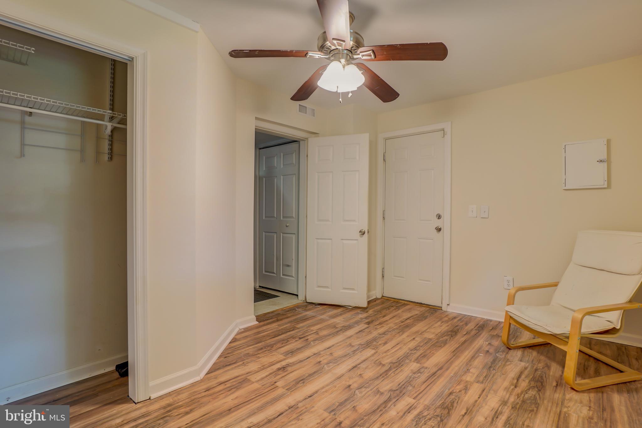 628 Four Mile Road Alexandria, VA 22305 - Photo 12 of 29 a view of a livingroom with wooden floor and a ceiling fan