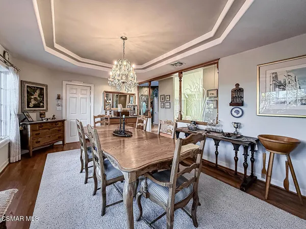 a view of a patio with table and chairs and potted plants