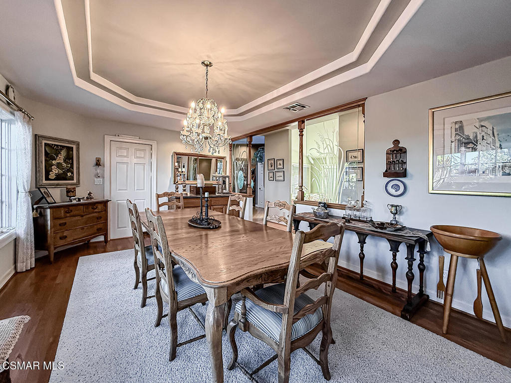 24525 Desert Avenue Newhall, CA 91321 - Photo 14 of 76 a view of a dining room with furniture window and wooden floor