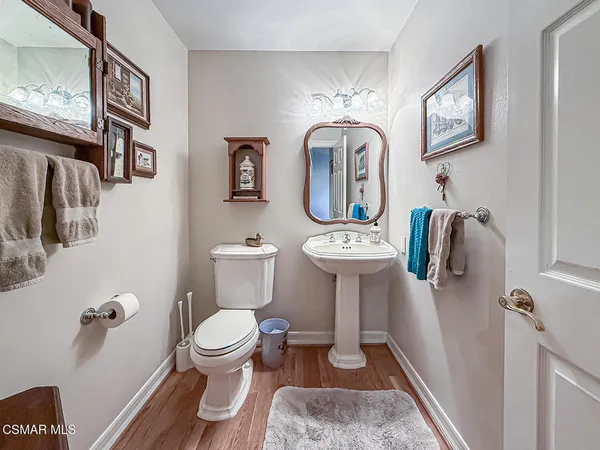 a room with a large window and a wooden floor