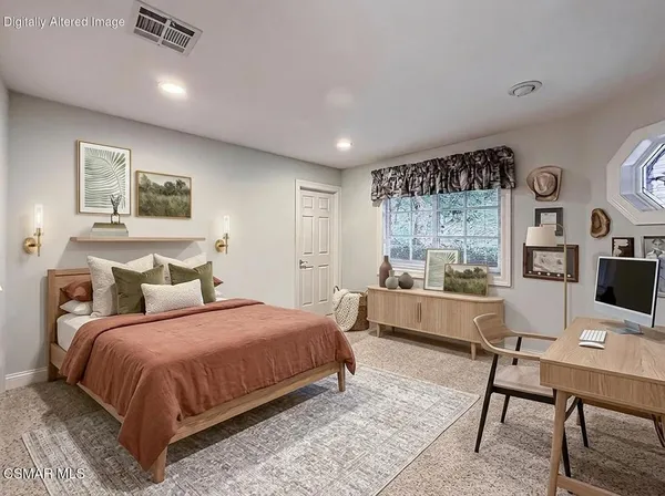 a dining room with furniture a rug and kitchen view