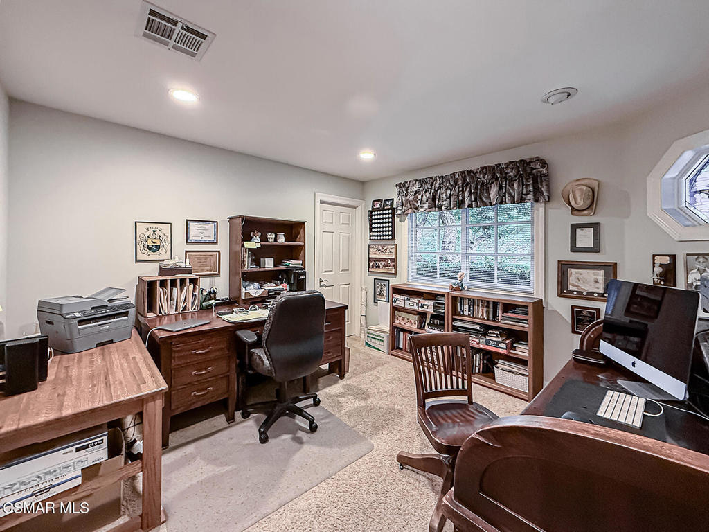 24525 Desert Avenue Newhall, CA 91321 - Photo 18 of 76 a view of a workspace with furniture and a window