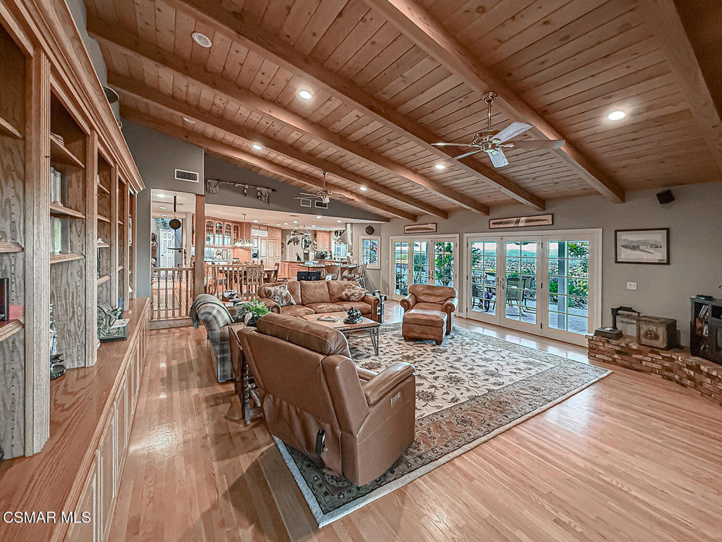 24525 Desert Avenue Newhall, CA 91321 - Photo 21 of 76 a living room with lots of furniture and wooden floors